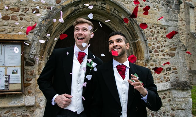 Gay wedding with two grooms celebrating