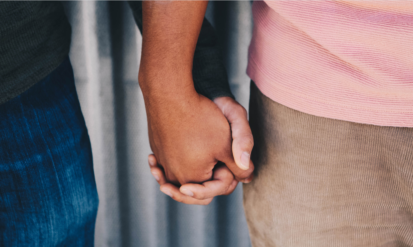 Couple holding hands